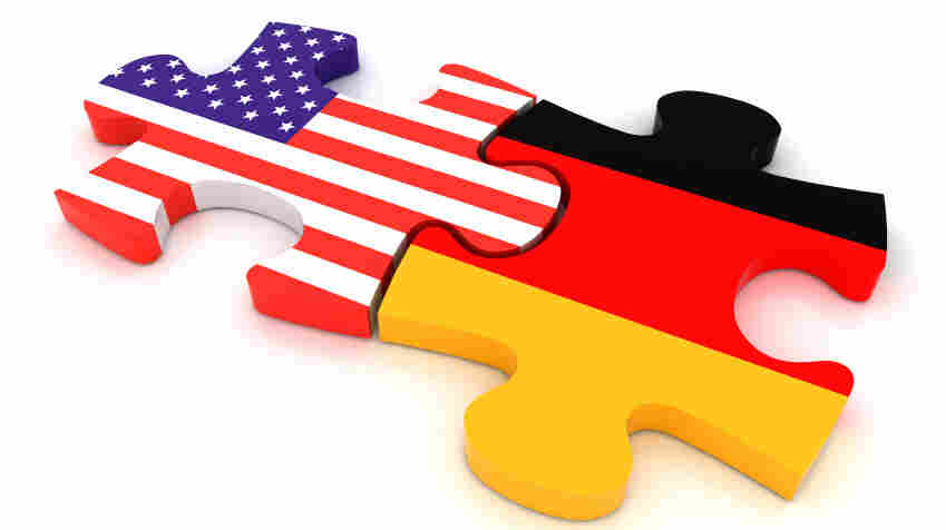 America and German flags as puzzle pieces.