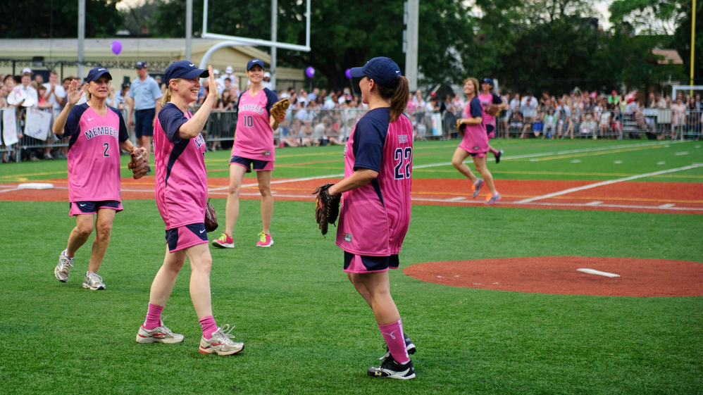 Sen. Kristen Gillibrand, D-N.Y., high-fives her teammate Rep. Martha Roby, R-Ala. during the annual Women's Congressional Softball Game last June. (The Washington Post/Getty Images)