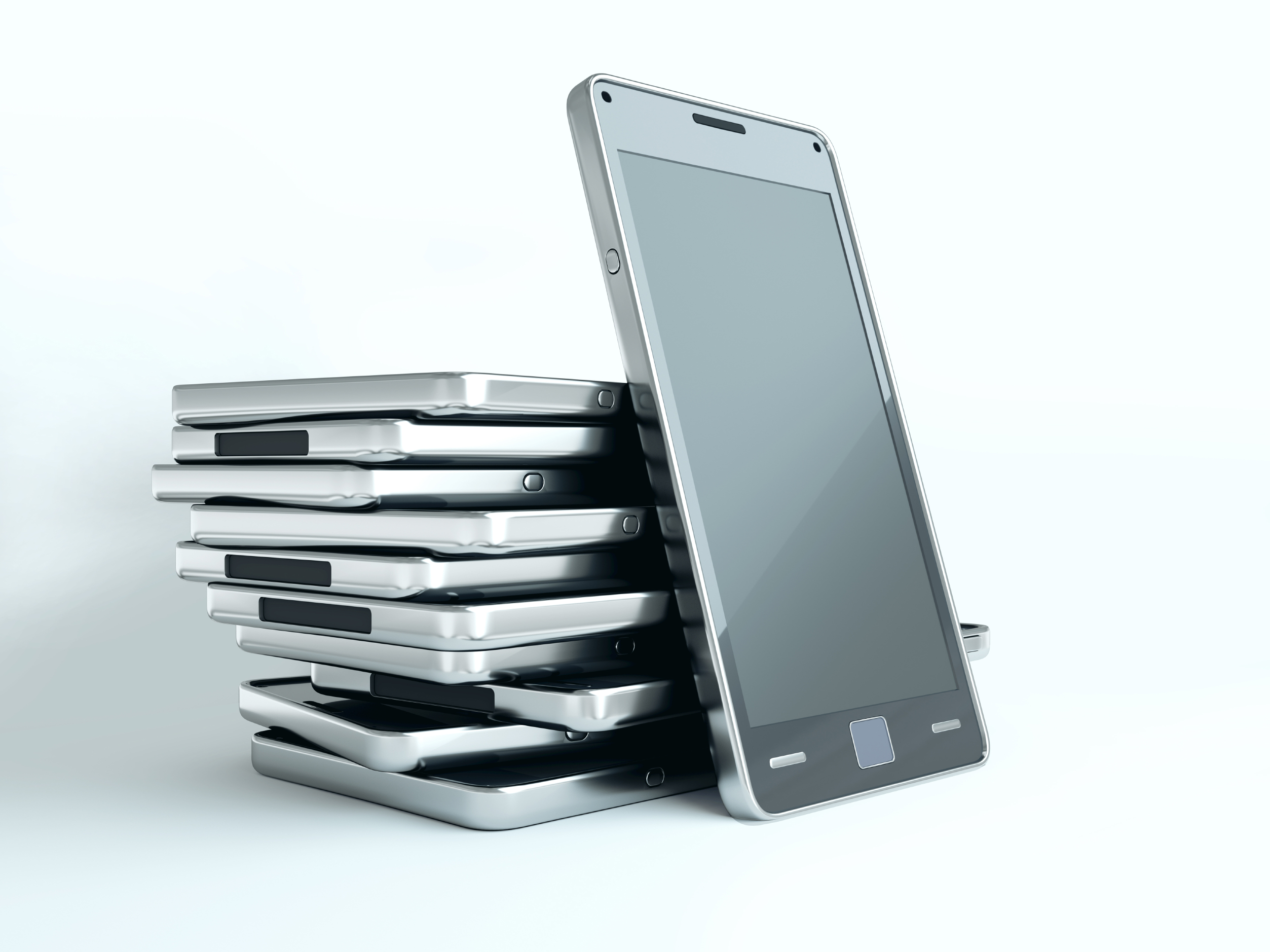 One way to avoid checking your phone at mealtime? Stack 'em up in the middle of the table. (iStockPhoto)