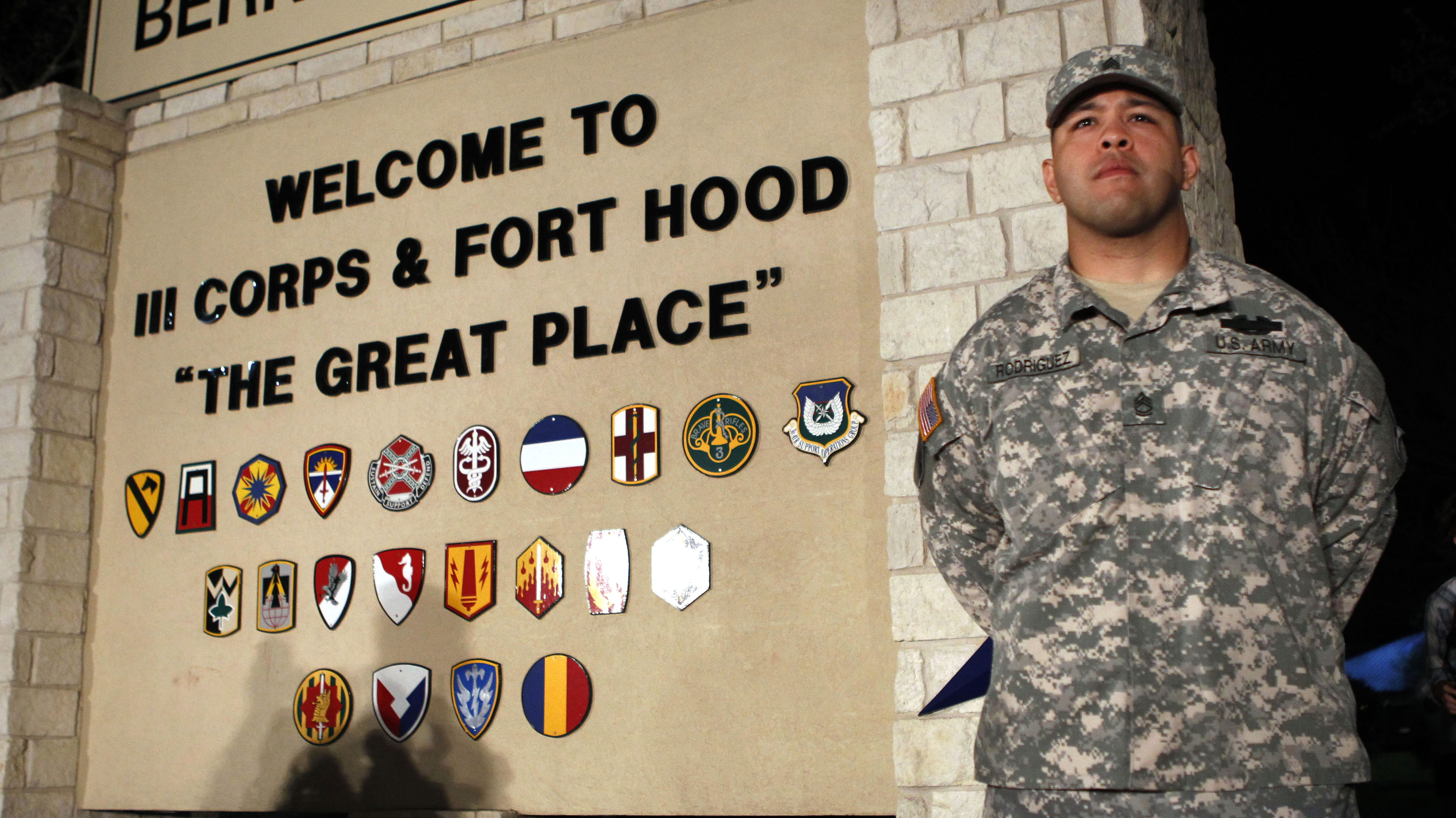 Sgt. First Class Erick Rodriguez stood guard at the entrance to Fort Hood as officials prepared to brief the news media about Wednesday's attack at the post. (Reuters/Landov)