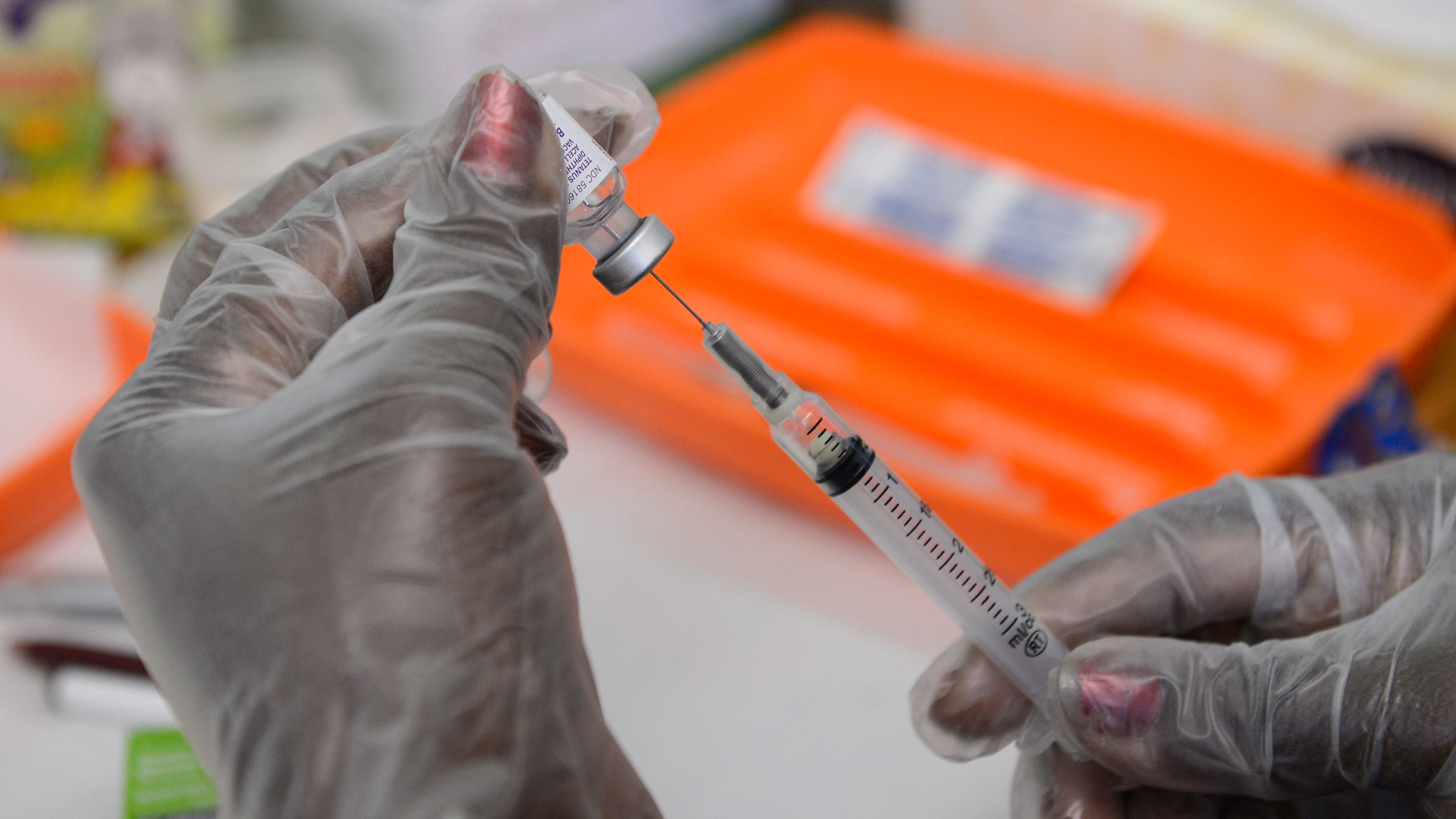 A school nurse prepares a vaccine against whooping cough before giving it to students at Mark Twain Middle School in Los Angeles. (Getty Images)