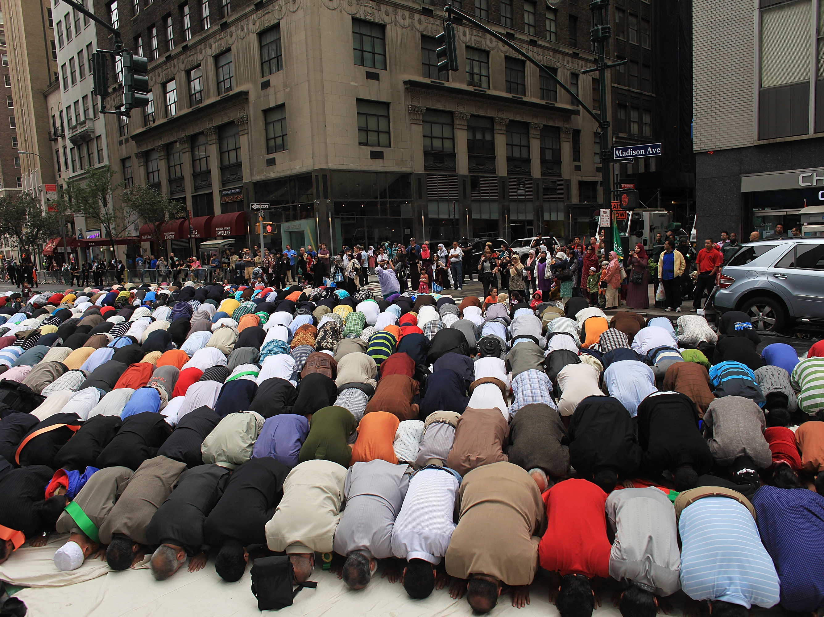 Men pray on the street before the start of the American Muslim Day Parade in 2010 in New York. (Getty Images)