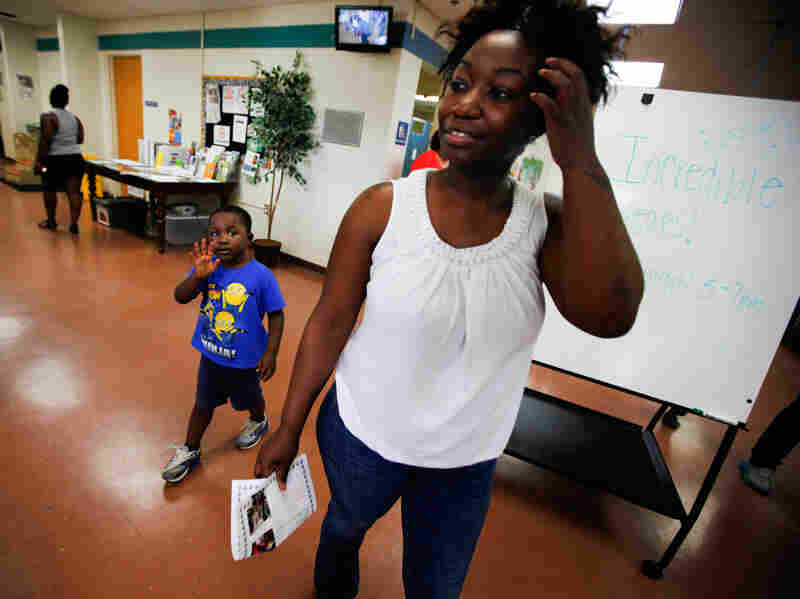 Shartara Wallace picks up her son James, 4, from preschool in Tulsa, Okla.