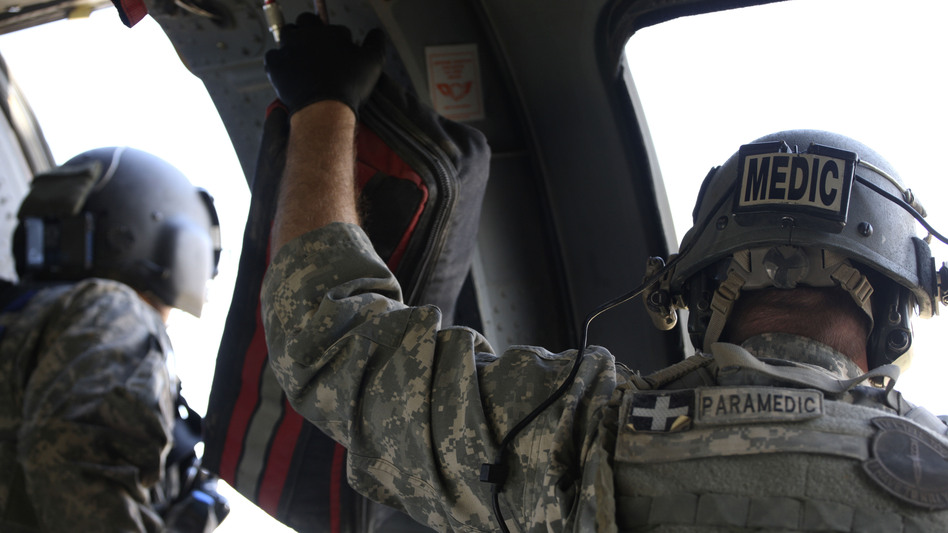 Veterans leave the service with high-level skills, like combat medicine, but it's often not easy to turn those skills into credentials for a civilian job. (Brennan Linsley/AP)