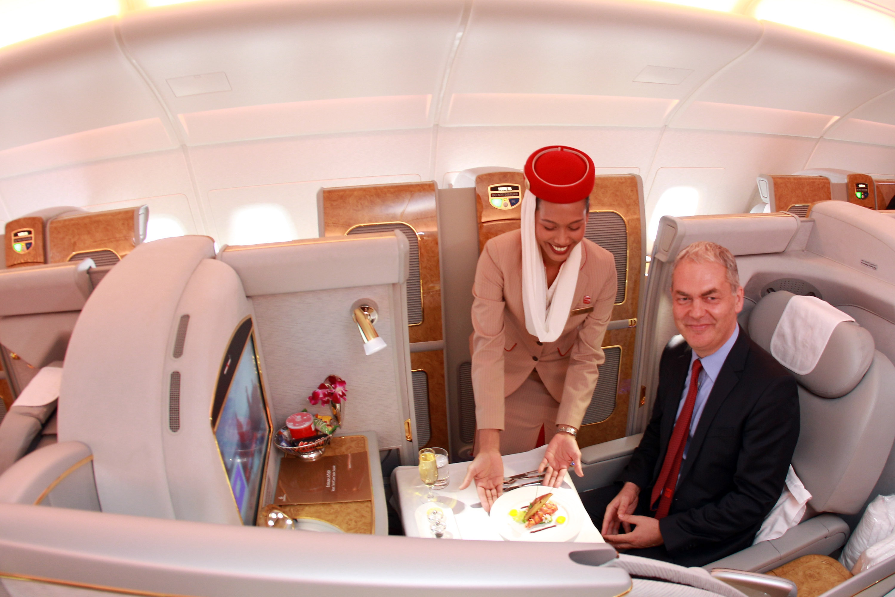 Emirates executive Thierry Antinori poses for the camera in a first-class seat aboard an Airbus A380 in Munich in 2011. (Getty Images)