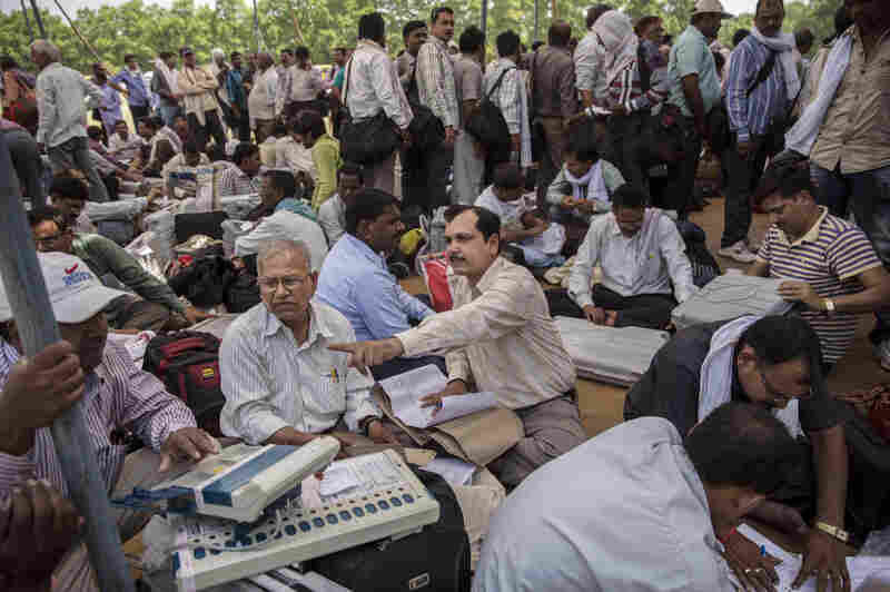 Indian election workers learn to use and check electronic voting machines on May 11.