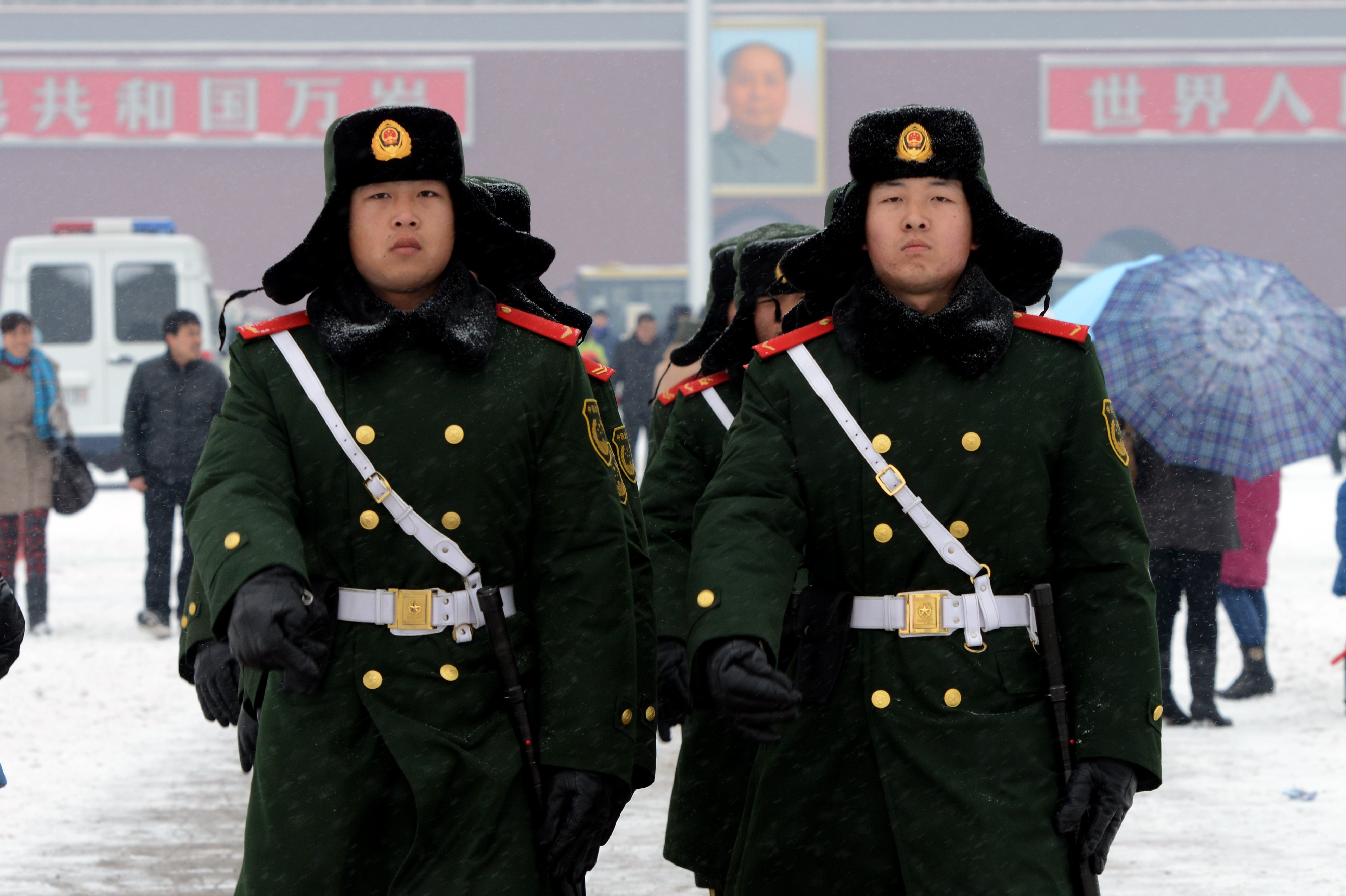Chinese paramilitary police march at Tiananmen Square in Beijing during winter 2014. (AFP/Getty Images)