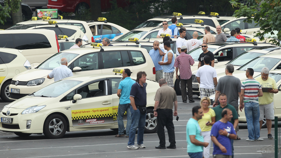 Taxi drivers gather in Berlin before joining an anti-Uber protest through the city. It coincided with similar protests in cities across Europe. (Sean Gallup/Getty Images)