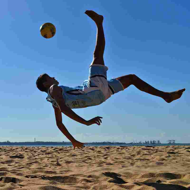Gearing Up: A Brazilian soccer player practices a bicycle kick in 2014.