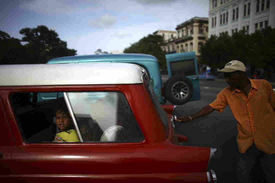 06: Kid in the back of red car