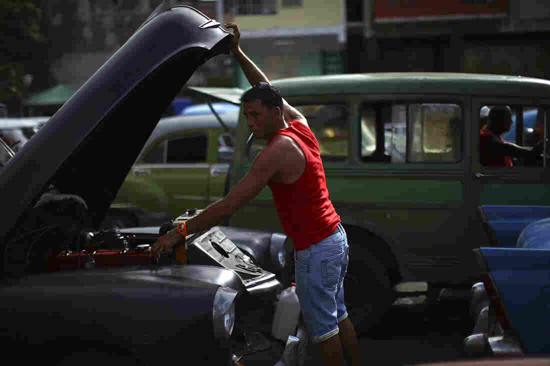 14: Red tank top and cigarette