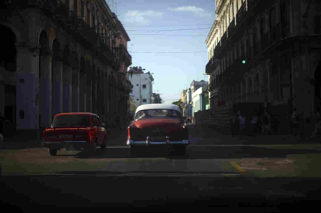 18: Two red cars
