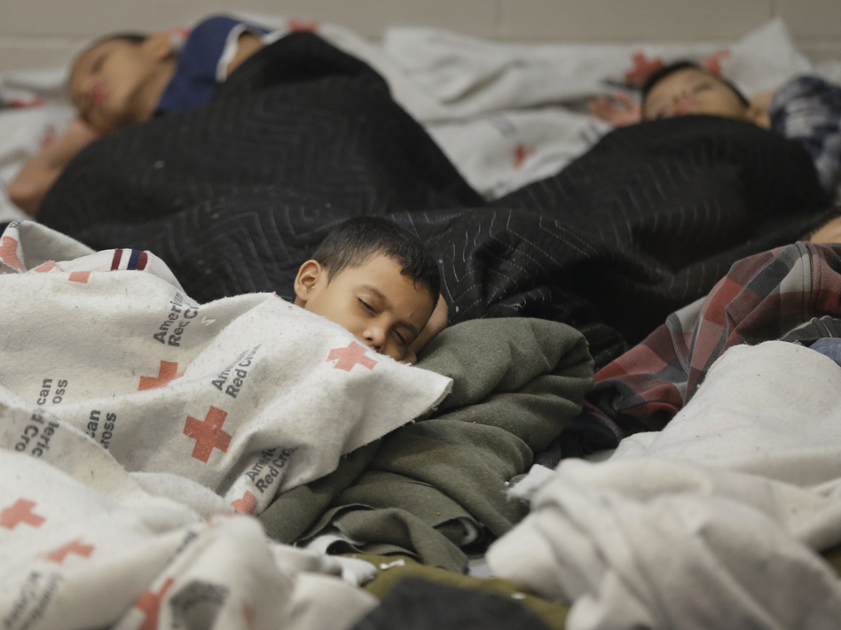 Detainees sleep in a holding cell at a U.S. Customs and Border Protection processing facility in Brownsville, Texas, on June 18. The White House on Tuesday sought $3.7 billion to deal with the immigration crisis at the border. (Eric Gay/AP)