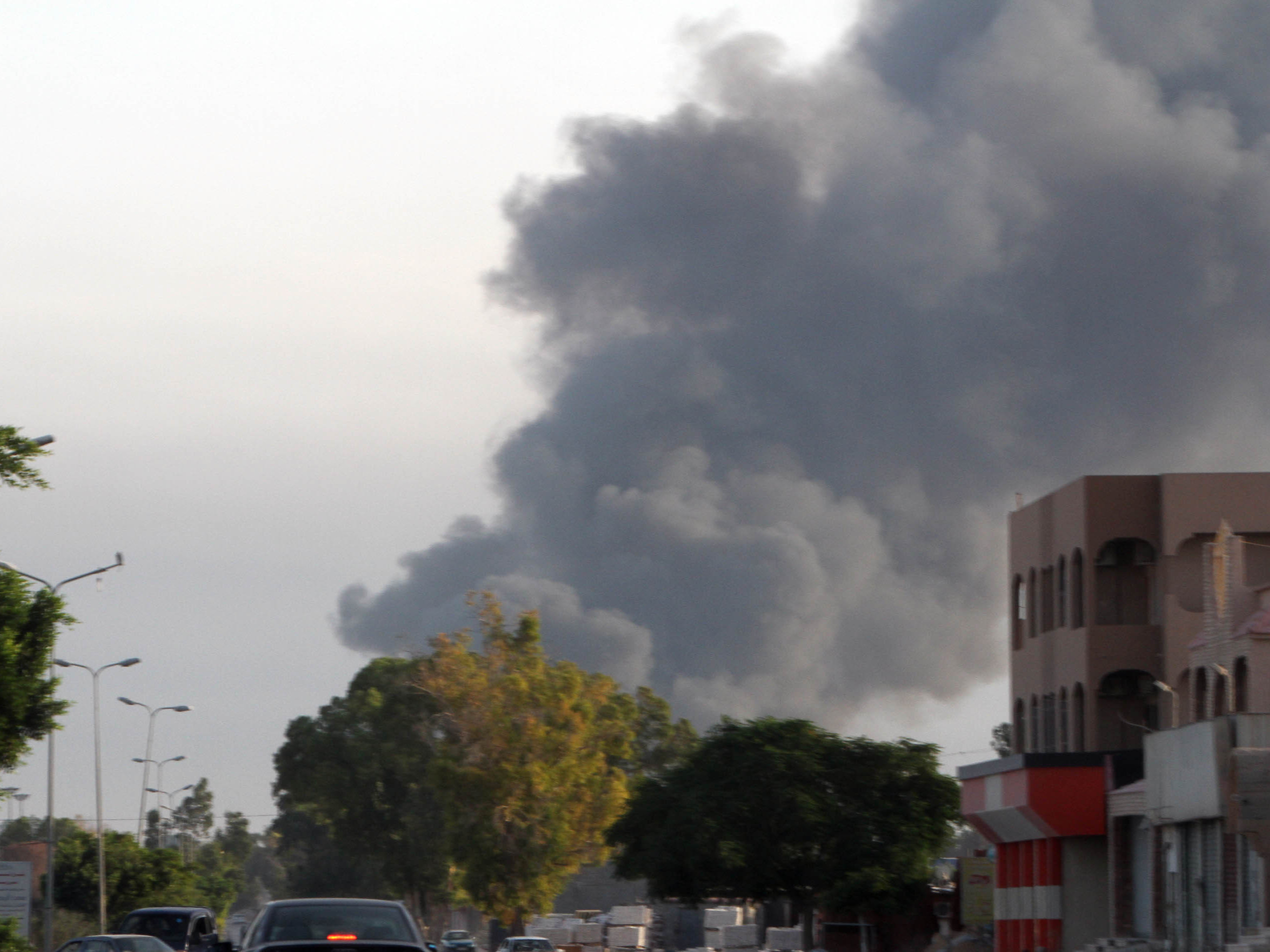 In a photo taken on Thursday, smoke rises from a residential area in Tripoli, Libya. Deadly clashes erupted between Islamist fighters and pro-secular militias earlier this month. (Xinhua/Landov)