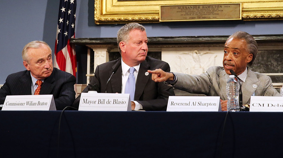 The death of Eric Garner in police custody has sparked controversy in New York City — and it's now been ruled a homicide. On Thursday, New York Mayor Bill de Blasio (center) sat with Police Commissioner Bill Bratton (left) and the Rev. Al Sharpton during a discussion on police-community relations. (Spencer Platt/Getty Images)