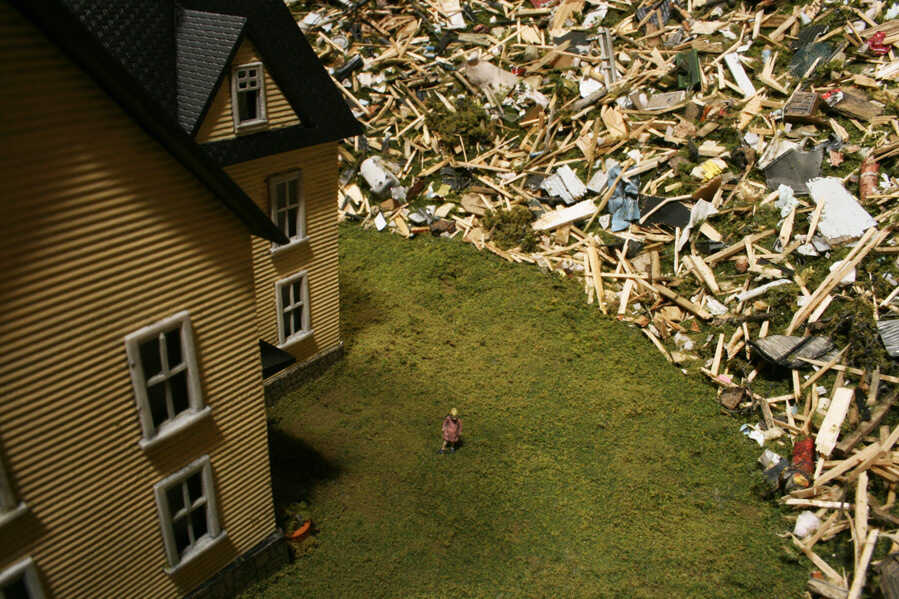 This figurine of a little girl is made from one taken from a model railroad set.