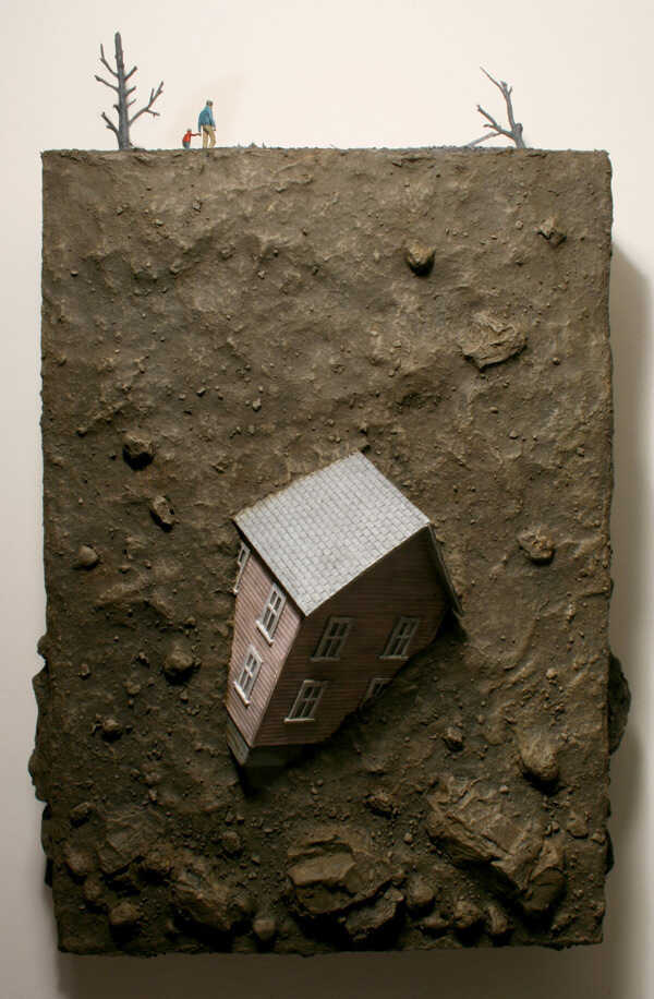 A house is buried beneath hundreds of feet of earth as a dad and his son walk above.