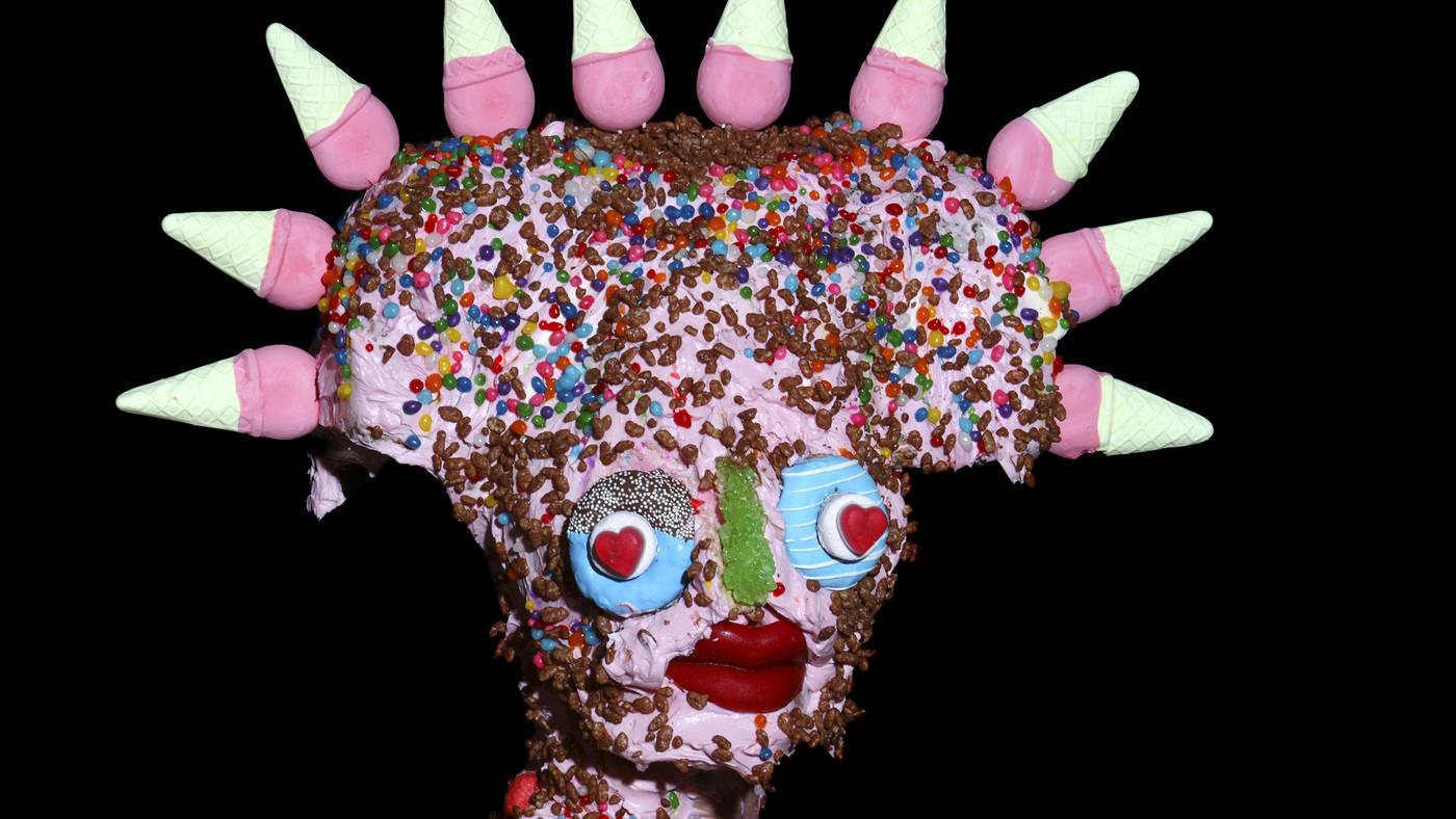 Beneath These Masks Is An Artist Conflicted By Junk Food