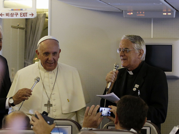 Pope Francis meets the media during an airborne news conference on his journey back to Rome from Seoul, South Korea, on Monday.