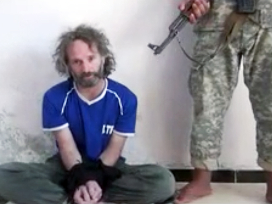 In this image made from undated video obtained by The Associated Press, a man believed to be Peter Theo Curtis, a U.S. citizen held hostage by an al-Qaida linked group in Syria, delivers a statement. (AP)
