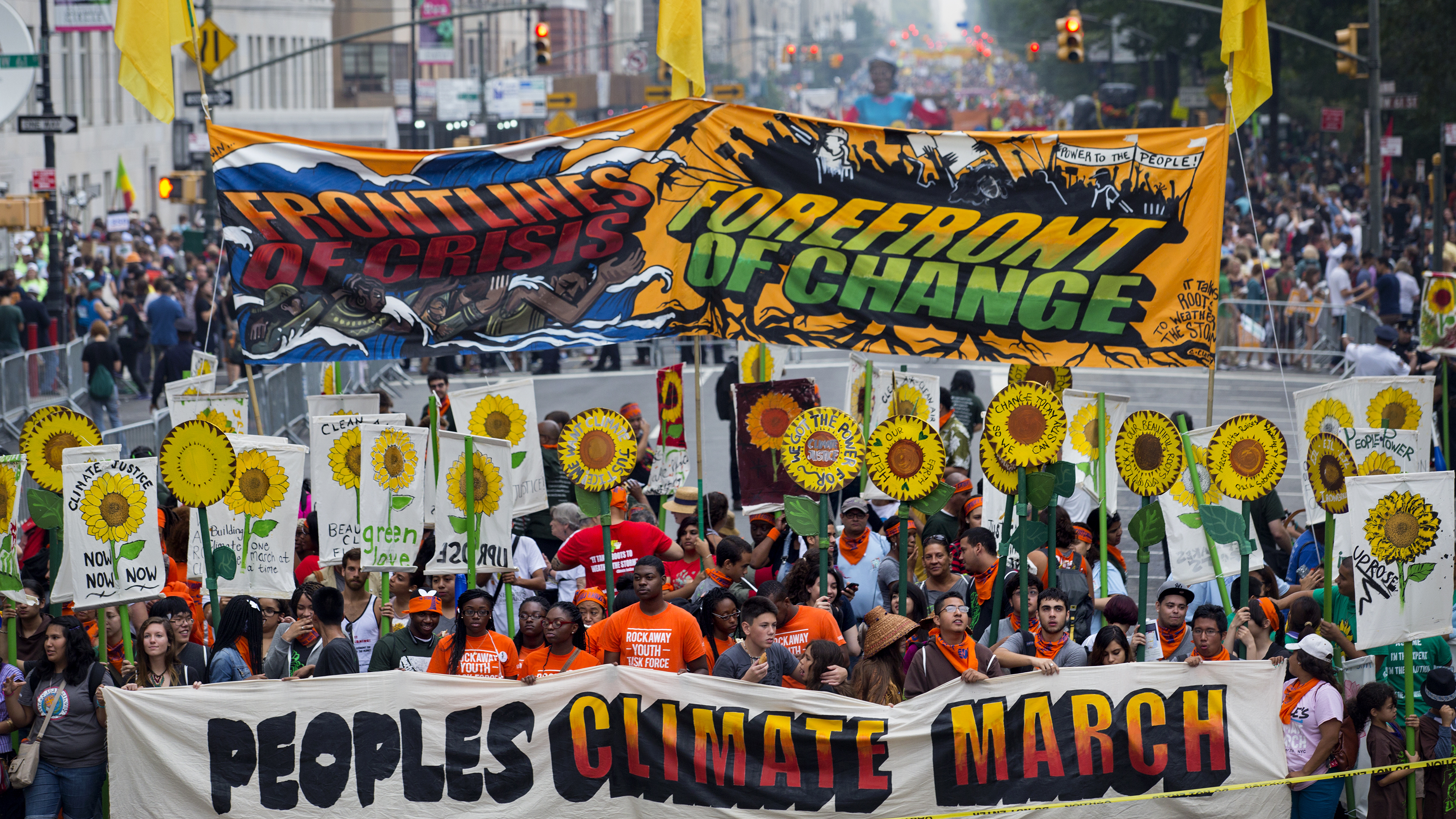 Demonstrators gather near Columbus Circle before the start of the People's Climate March in New York Sunday. Organizers are hoping 100,000 people worldwide might participate in the rally. (AP)