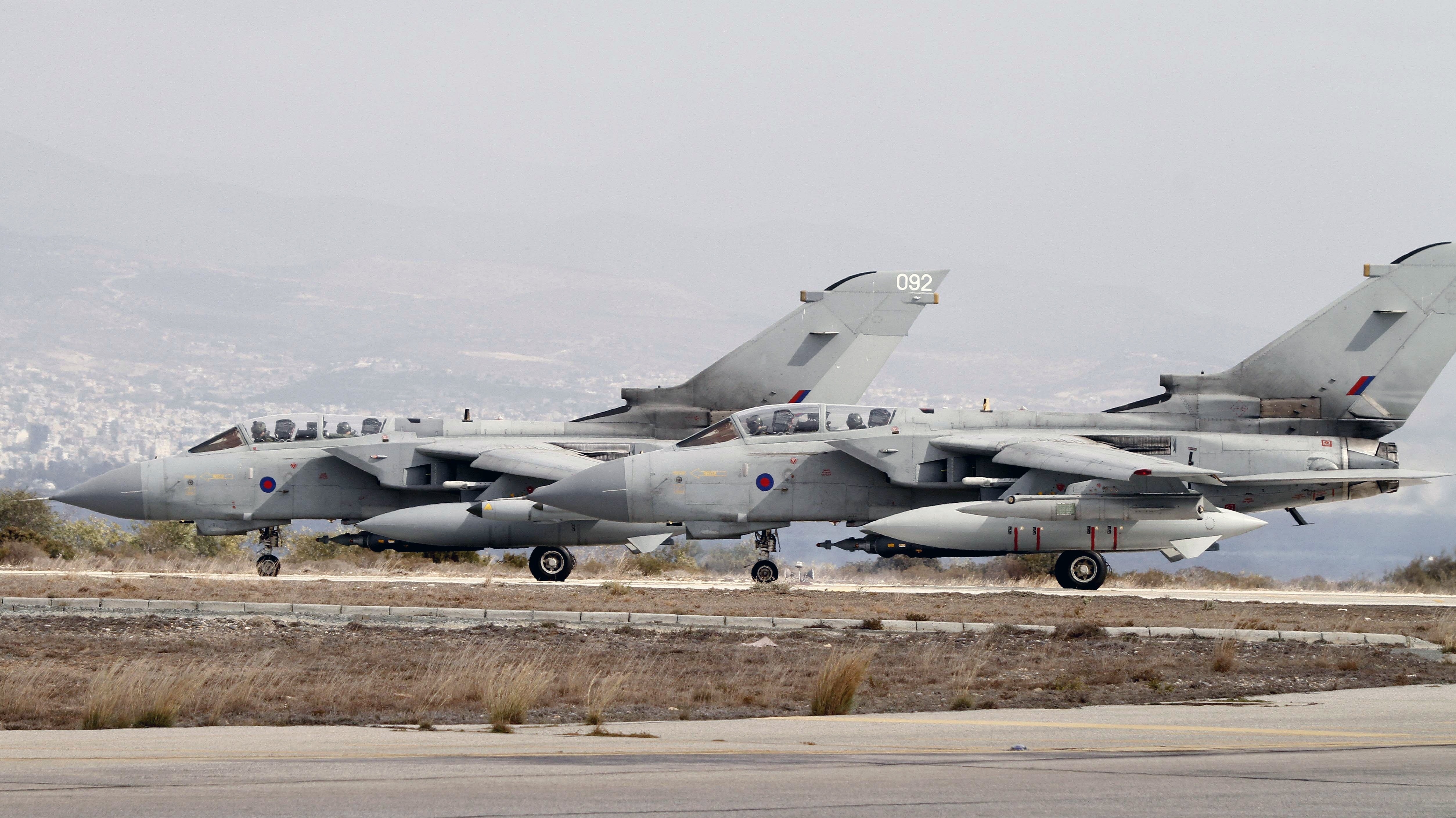 Two Royal Air Force Tornado GR4 fighter jets prepare to take off Saturday from an airbase in Cyprus. The British warplanes were heading on their first mission over Iraq since being given parliamentary authority to strike at ISIS Friday.