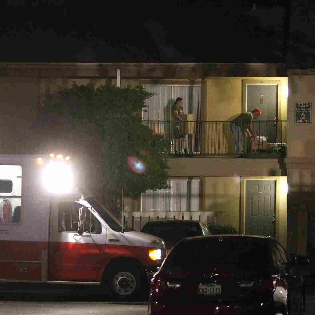 A Red Cross worker delivers bedding to a unit at The Ivy Apartments in Dallas, where a man diagnosed with the Ebola virus had been staying.