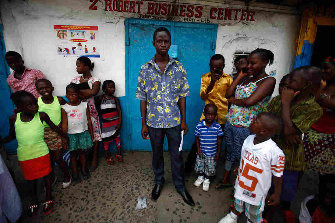 Anthony Gboye, 21, waits for the bus.