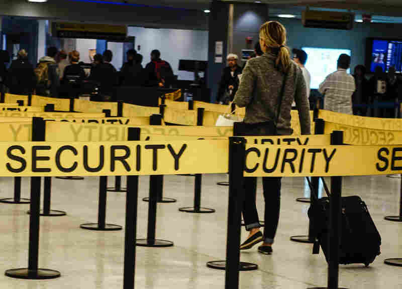 Passengers make their way in a security checkpoint at the International JFK airport in New York on Oct. 11, 2014. Medical teams at New York's JFK airport, armed with Ebola questionnaires and temperature guns, began screening travelers from three West African countries on Saturday as U.S. health authorities stepped up efforts to stop the spread of the virus.