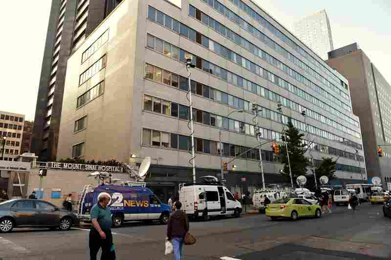 Television trucks converged on Mount Sinai Hospital in New York on Monday after it announced that it was screening a patient for Ebola virus.