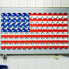 An American flag made of plates is on display at the Homer Laughlin China Co. in Newell, W. Va.