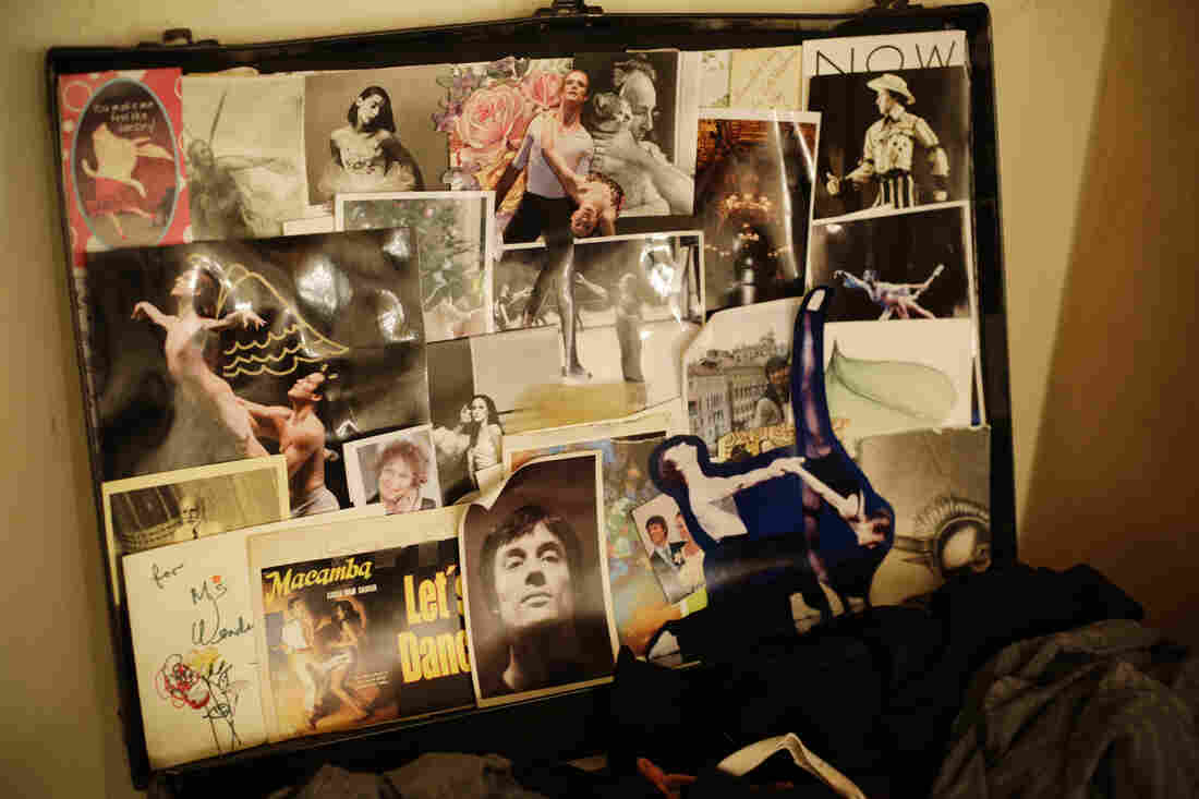 A collage in Whelan's theater case includes a portrait of her husband (bottom center) and a photo given to her by choreographer Christopher Wheeldon with a hand-drawn angel and devil motif.