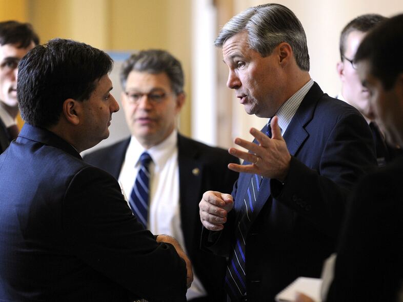 Ron Klain (left), then chief of staff for Vice President Joe Biden, talks with Sen. Sheldon Whitehouse on Capitol Hill in December 2009. (Jonathan Ernst/Reuters/Landov)