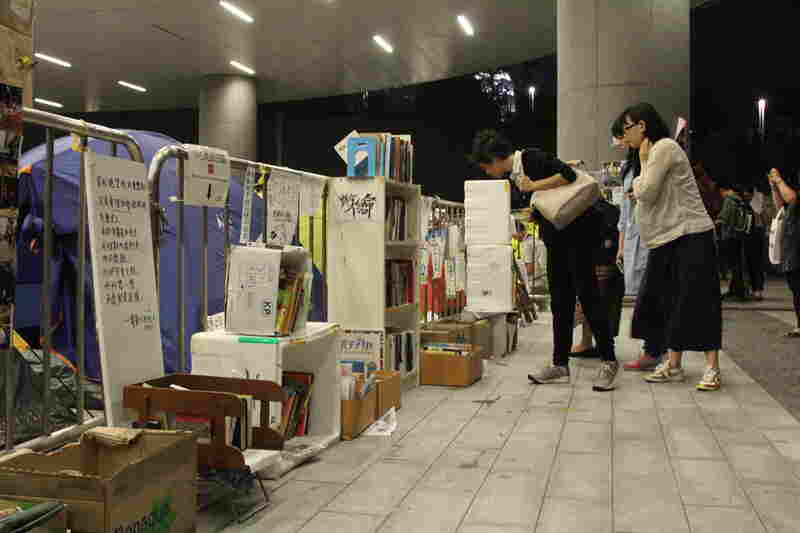 Protesters built a library in the parking lot of the Hong Kong leglislative council building. Volumes include Pride and Prejudice and The Economics of John Maynard Keynes.