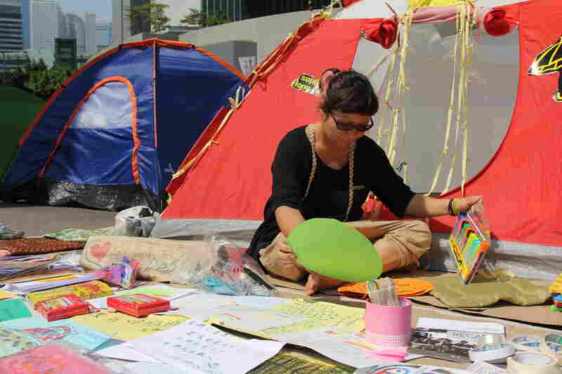 Map Tang, a social worker, has set up an art therapy center at her tent. She says protesters are exhausted after three weeks of demonstrations and need a way to express their feelings.