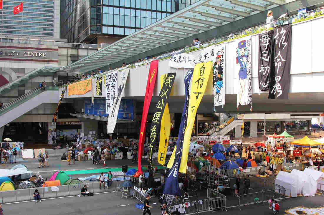 A pedestrian bridge over the main protest camp in Hong Kong's Admiralty district. The orange banner at the far left says, "Do You Hear The People Sing?" the title of a song from Les Miserables, the musical set in 19th-century, revolutionary-era France.