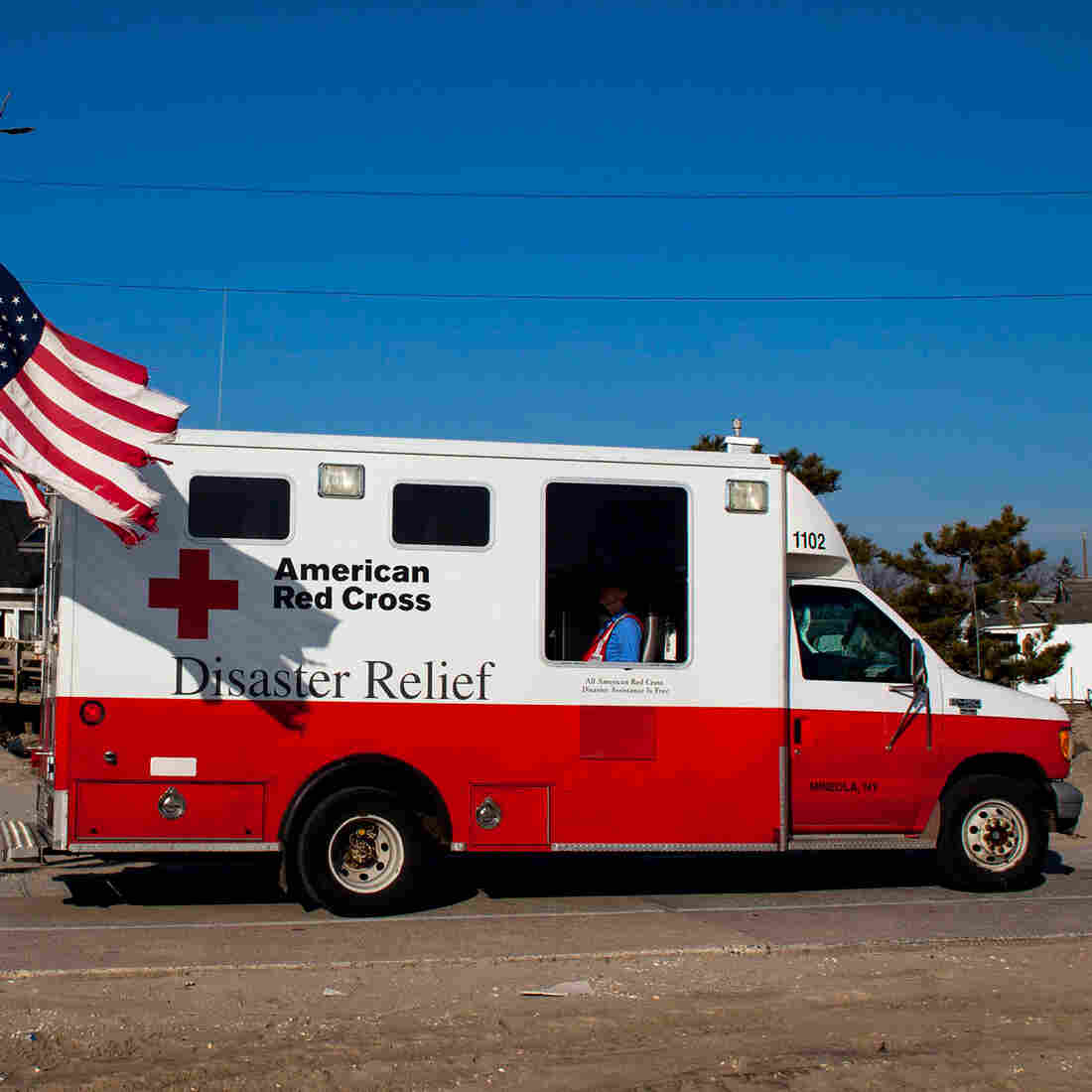 In the aftermath of Superstorm Sandy, a former Red Cross official says, as many as 40 percent of the organization's emergency vehicles were assigned for public relations purposes. This photo, which shows one of the trucks in Long Island, N.Y., in January 2013, is one example of the many publicity photos taken by the Red Cross. In the aftermath of Superstorm Sandy, a former Red Cross official says, as many as 40 percent of the organization's emergency vehicles were assigned for public relations purposes. This photo, which shows one of the trucks in Long Island, N.Y., in January 2013, is one example of the many publicity photos taken by the Red Cross.