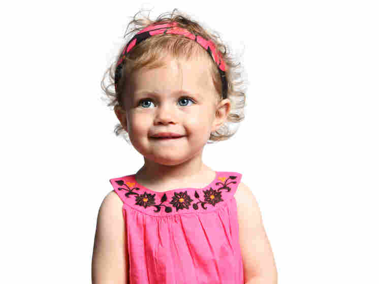 Young girl in a pink dress.
