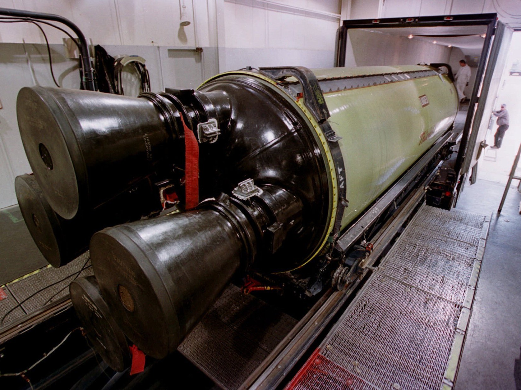A Minuteman III missile engine is loaded into a truck for transport to another building for X-raying before being torn down and rebuilt. The Air Force's missile command-and-control structure has been the subject of several recent scandals.