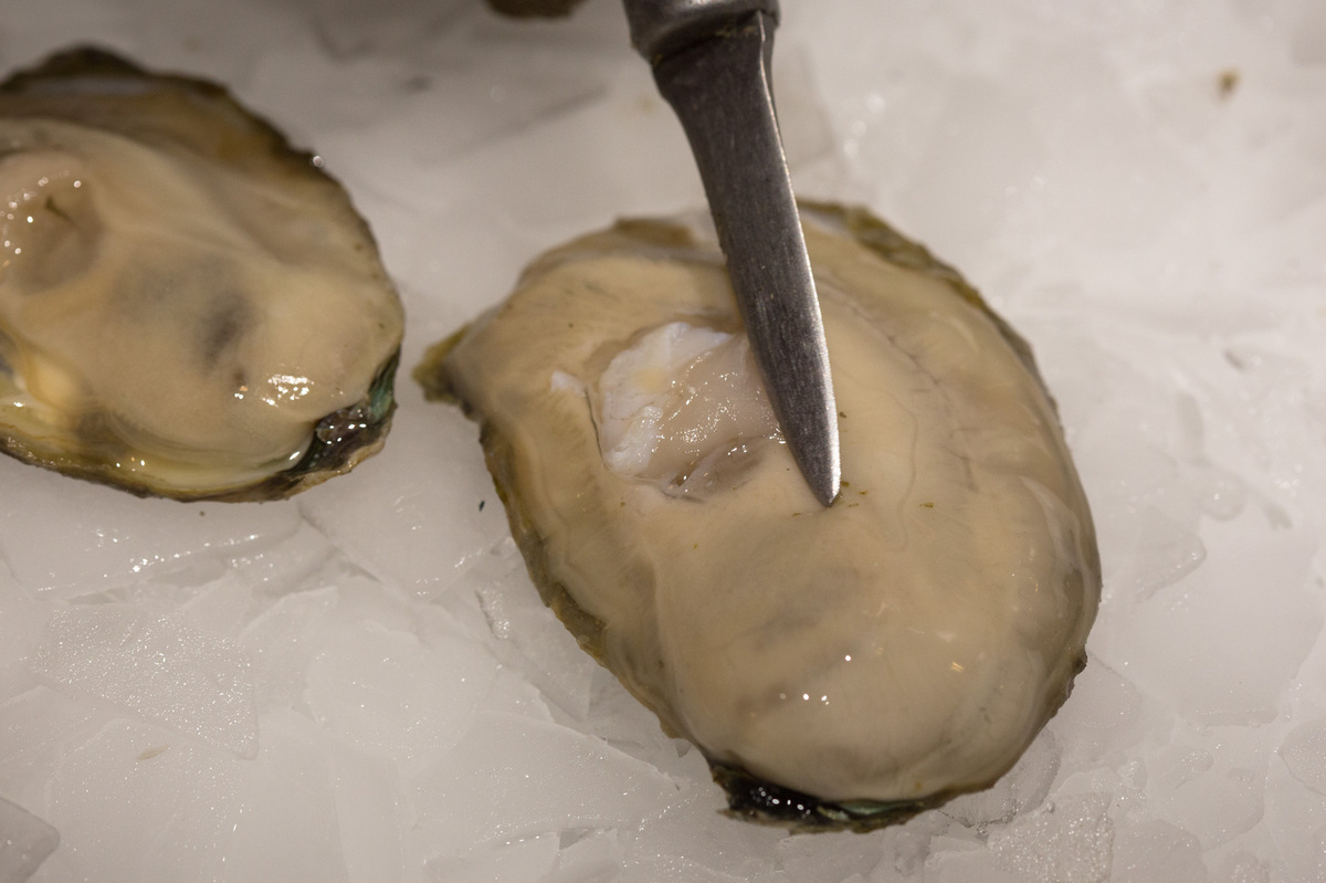 Shucking Oysters By The Thousands, With A Steady Smile The Salt NPR