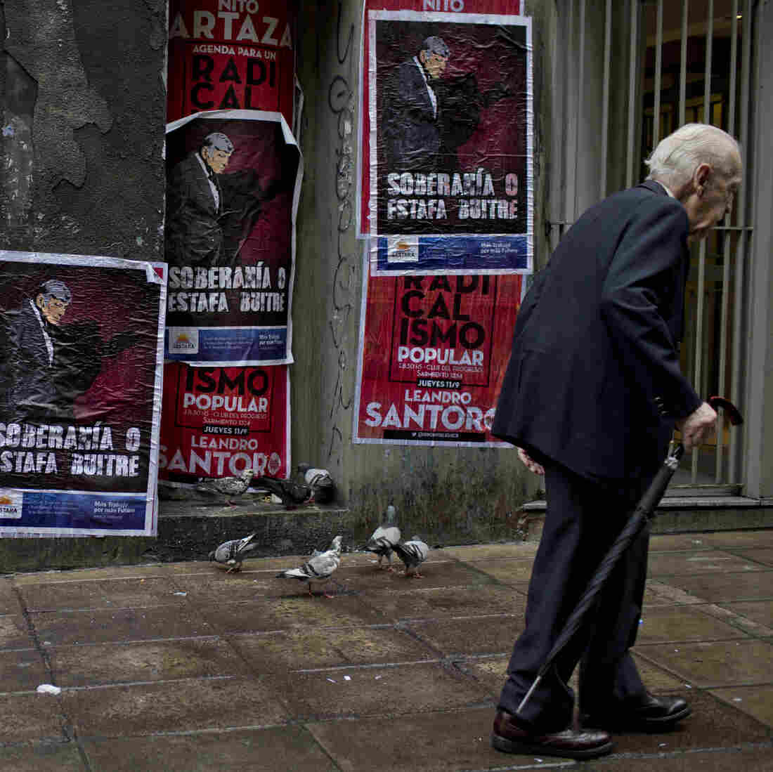 A wall in Buenos Aires, Argentina, displays posters with an image of U.S. Judge Thomas Griesa and a message in Spanish — "Sovereignty or vulture scam" — in support of Argentina's government in its dispute against a U.S. hedge fund, known locally as a "vulture fund." A wall in Buenos Aires, Argentina, displays posters with an image of U.S. Judge Thomas Griesa and a message in Spanish — "Sovereignty or vulture scam" — in support of Argentina's government in its dispute against a U.S. hedge fund, known locally as a "vulture fund."