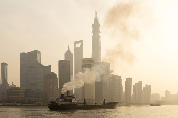 A ship sails up the Huangpu River as heavy smog engulfs the city on Dec. 25 in Shanghai, China. Both China and the U.S. recently announced targets for cutting greenhouse gas emissions over the next 15 years.