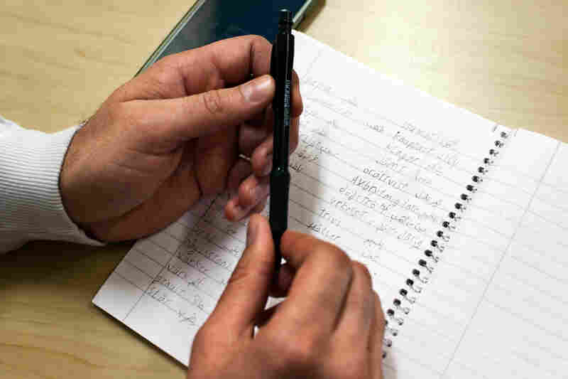 Firas Jabro of Qamishli, Syria, wrote Swedish words and their Arabic translations in the Swedish language class. Sodertalje's unemployment rate is twice as high as Sweden's national rate. That's partly because refugees are struggling to learn Swedish, a requirement for a job.