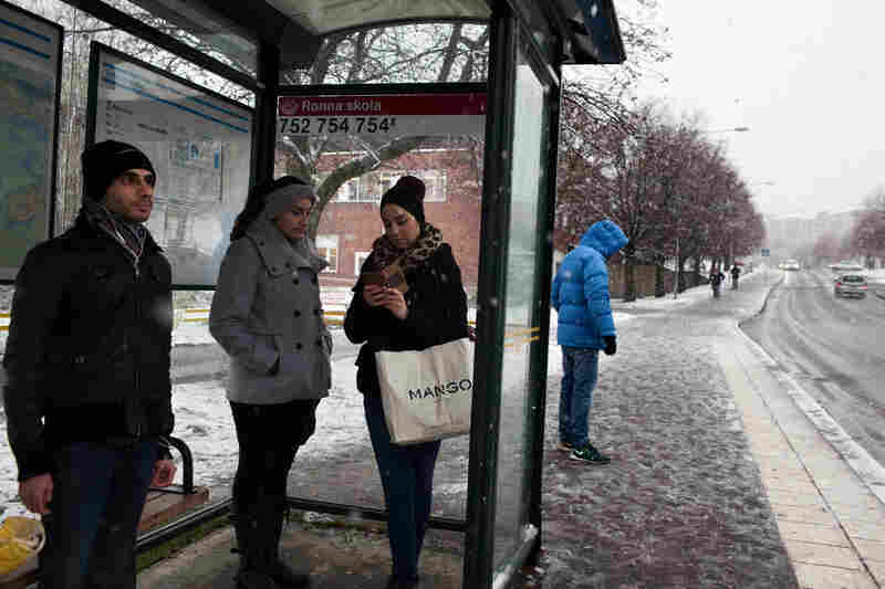 Residents wait at the bus stop in the Ronna neighborhood, where Syrian and Iraqi refugees are concentrated in Södertalje, Sweden. The small Swedish city is known for its open-door policy toward refugees, which is mostly made up of Christian Syrians and Iraqis. People of Middle East origin account for 30,000 of the town's 90,000 residents.