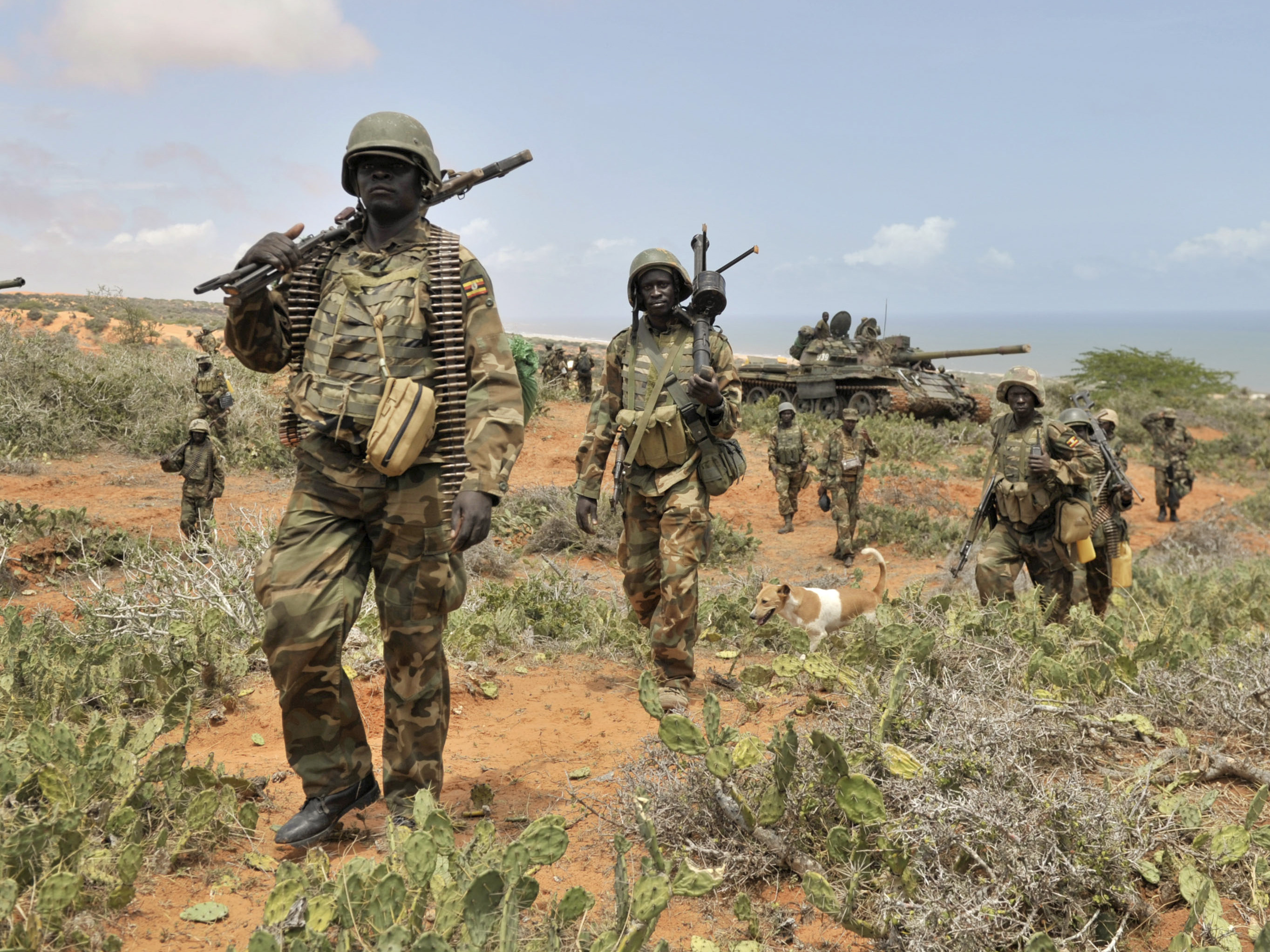 African Union Mission to Somalia (AMISOM), African Union soldiers march along the top of a hill overlooking the al-Shabab stronghold of Barawe, a coastal town 135 miles southwest of Mogadishu, in Somalia, in October.