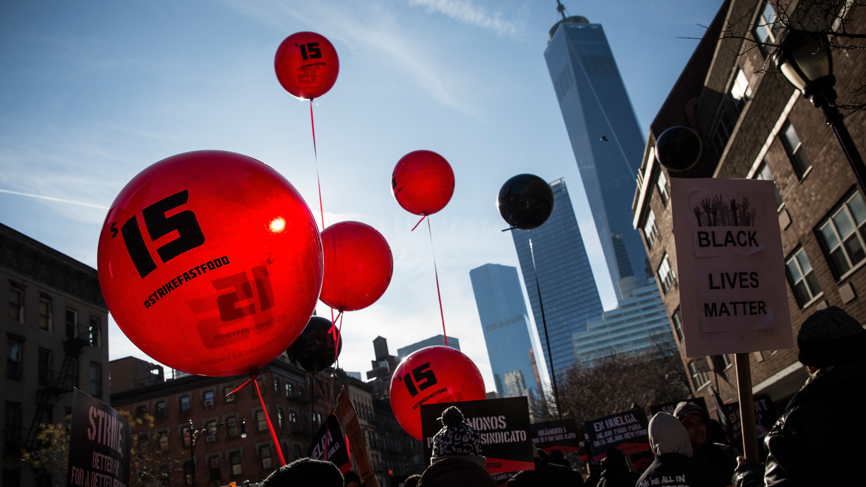 Protesters march in New York City on Dec. 4 to demand an increase in the minimum wage to $15 per hour. New York state's minimum wage rose to $8.75 on Wednesday. (Getty Images)