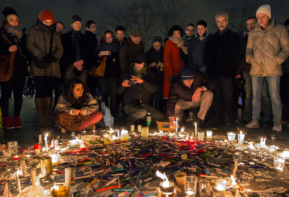 Pens are thrown on the ground during a vigil in Paris following a deadly attack at the offices of <em>Charlie Hebdo</em>, the weekly satirical magazine. (Dan Kitwood/Getty Images)