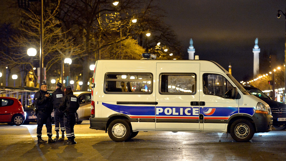 Police officers look for an escaped suspect Jan. 9 in Porte de Vincennes in Paris, France. Hayat Boumeddiene, 26, escaped and is wanted in connection with the murder of a policewoman. (Aurelien Meunier/Getty Images)