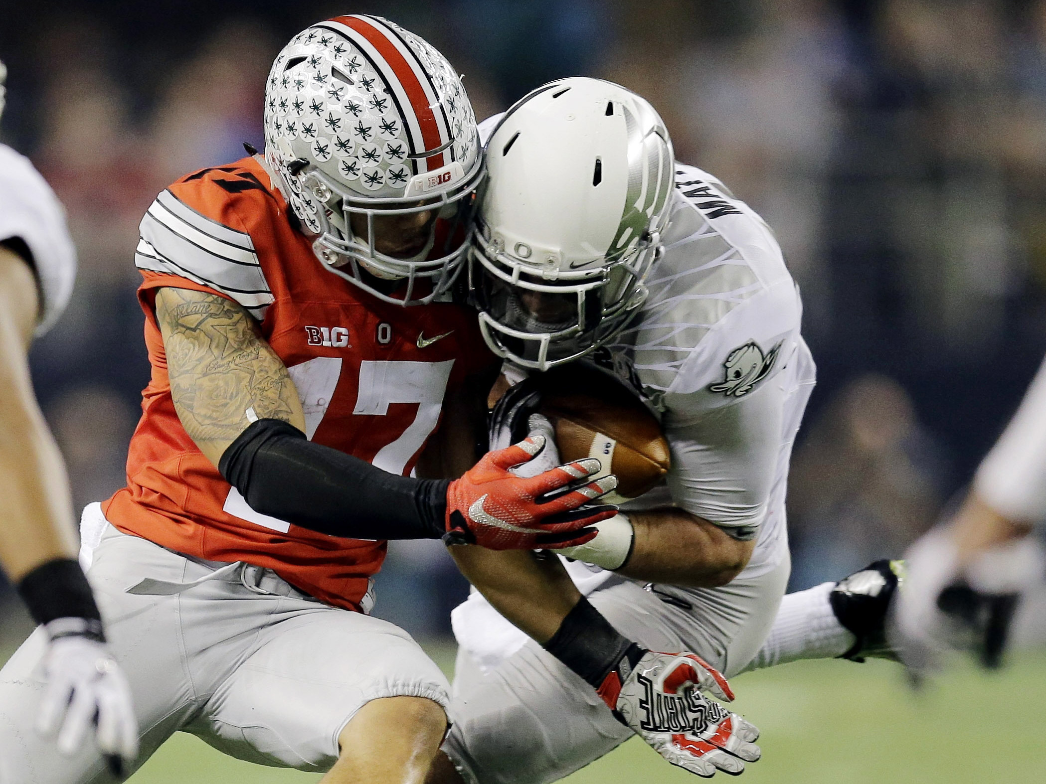Oregon's Danny Mattingly intercepts a pass intended for Ohio State's Jalin Marshall on Monday during the second half of the NCAA college football playoff championship game.