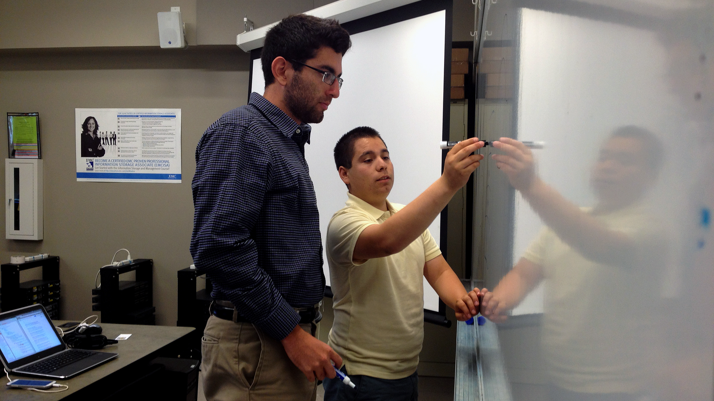 CSIT-In-3 students Daniel Diaz (left) and Brian De Anda map out options for reducing the size of a mobile app their team is building. (KAZU)
